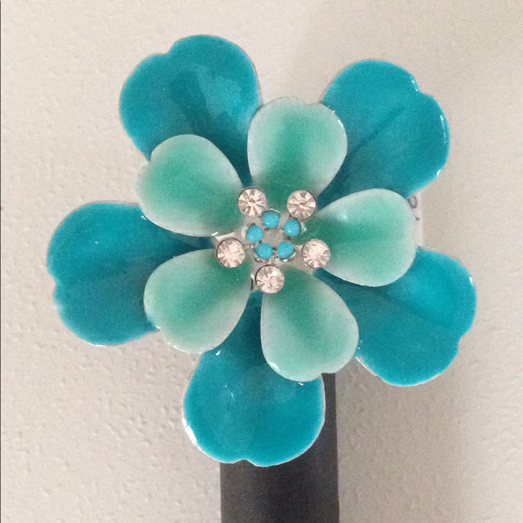 Ring With A 2 Inch Turquoise Flower With Crystals